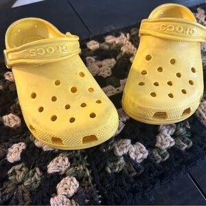 Children’s yellow crocs